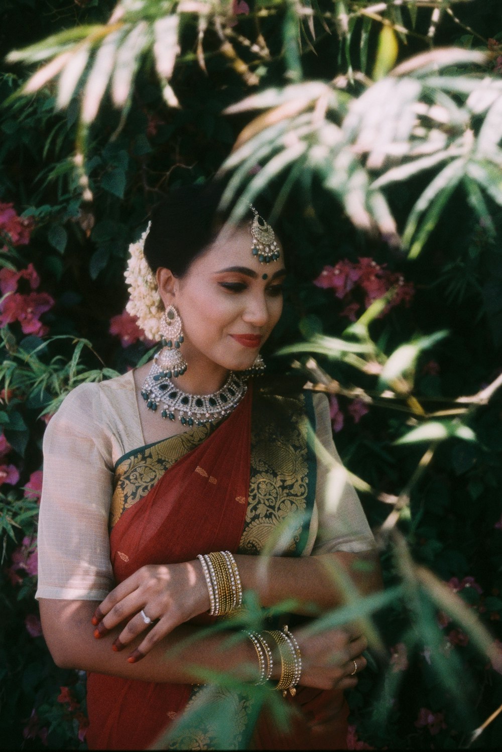 a woman in a red and gold sari