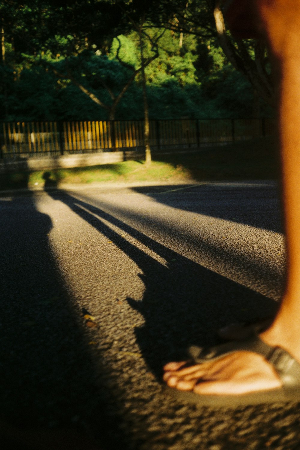 a person walking down a street with their foot in the air