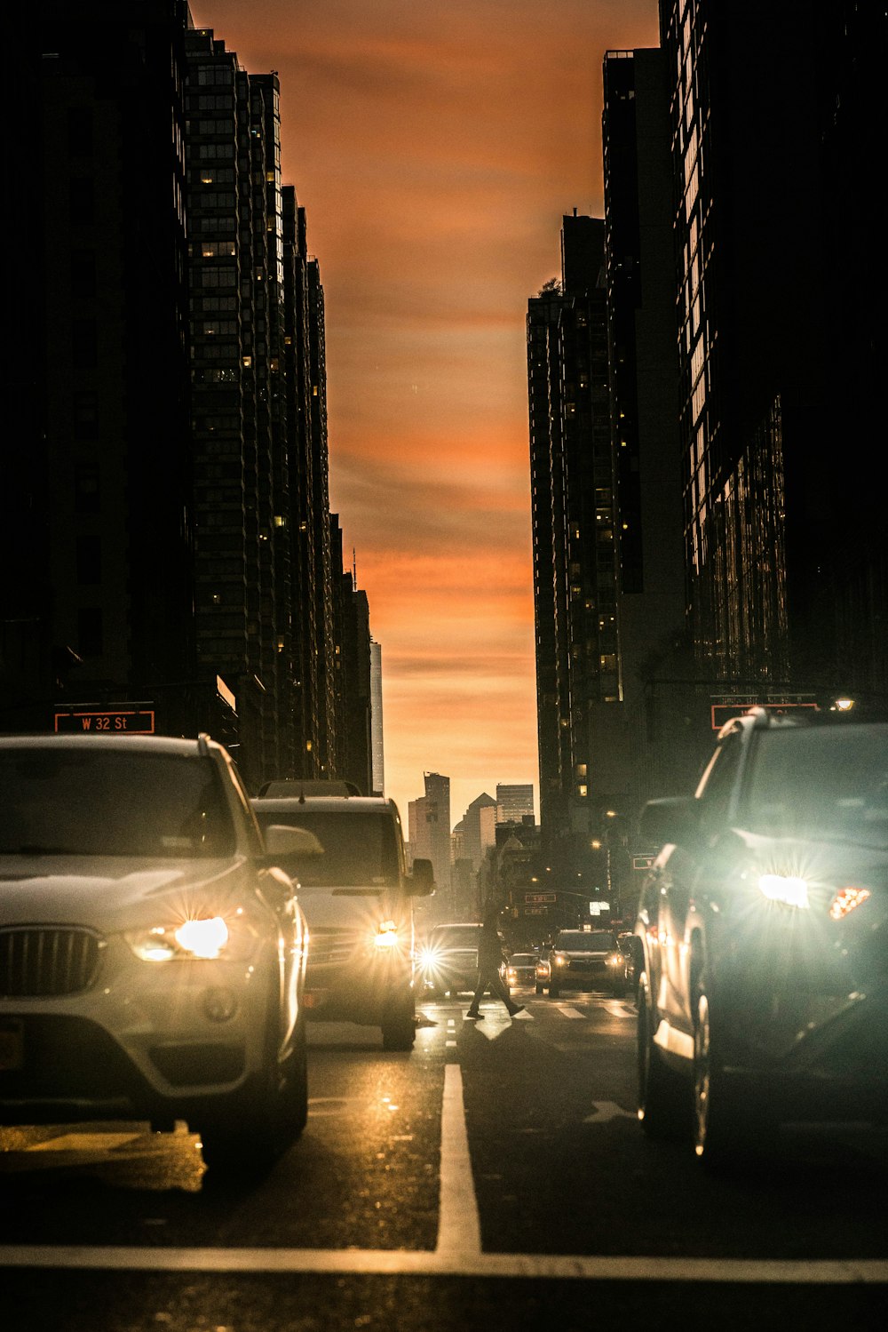 a city street filled with lots of traffic at night