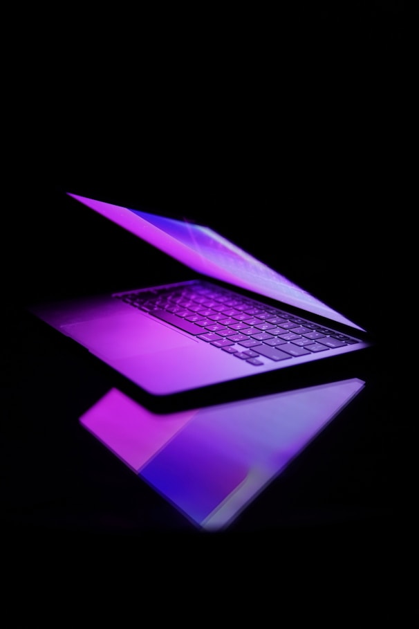 a laptop computer sitting on top of a table
