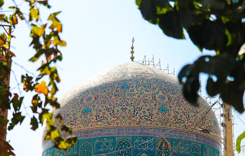 a close up of a building with a blue dome