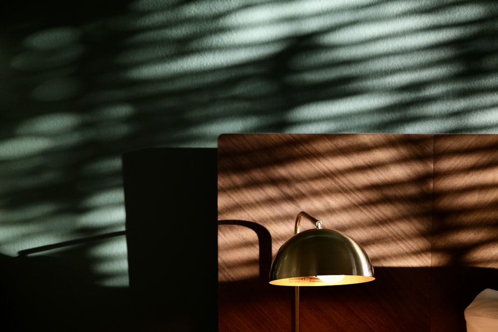a lamp sitting on top of a wooden table