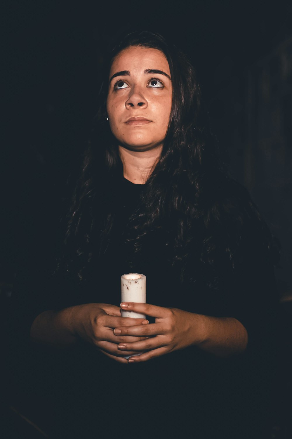 a woman holding a cup of coffee in her hands