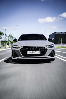 A sleek, modern car speeding through a cityscape.