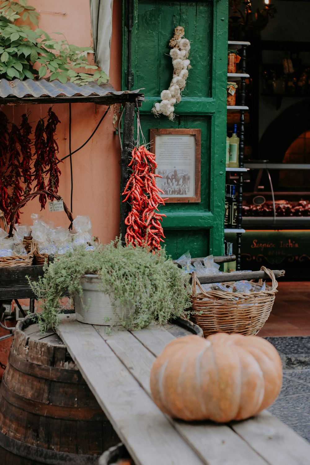 a wooden table topped with lots of vegetables