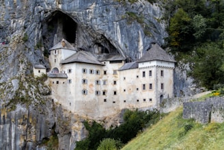 a castle built into the side of a cliff