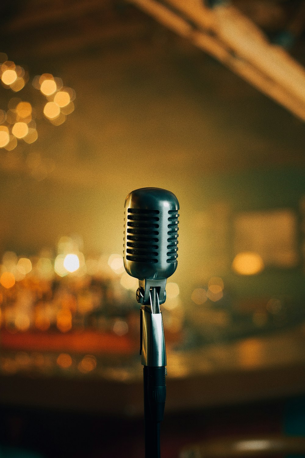 a black microphone with a blurry background