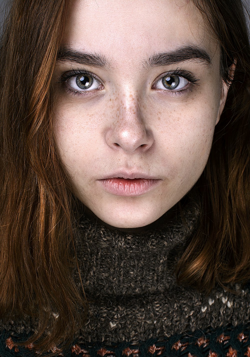 a close up of a person with freckles on her face