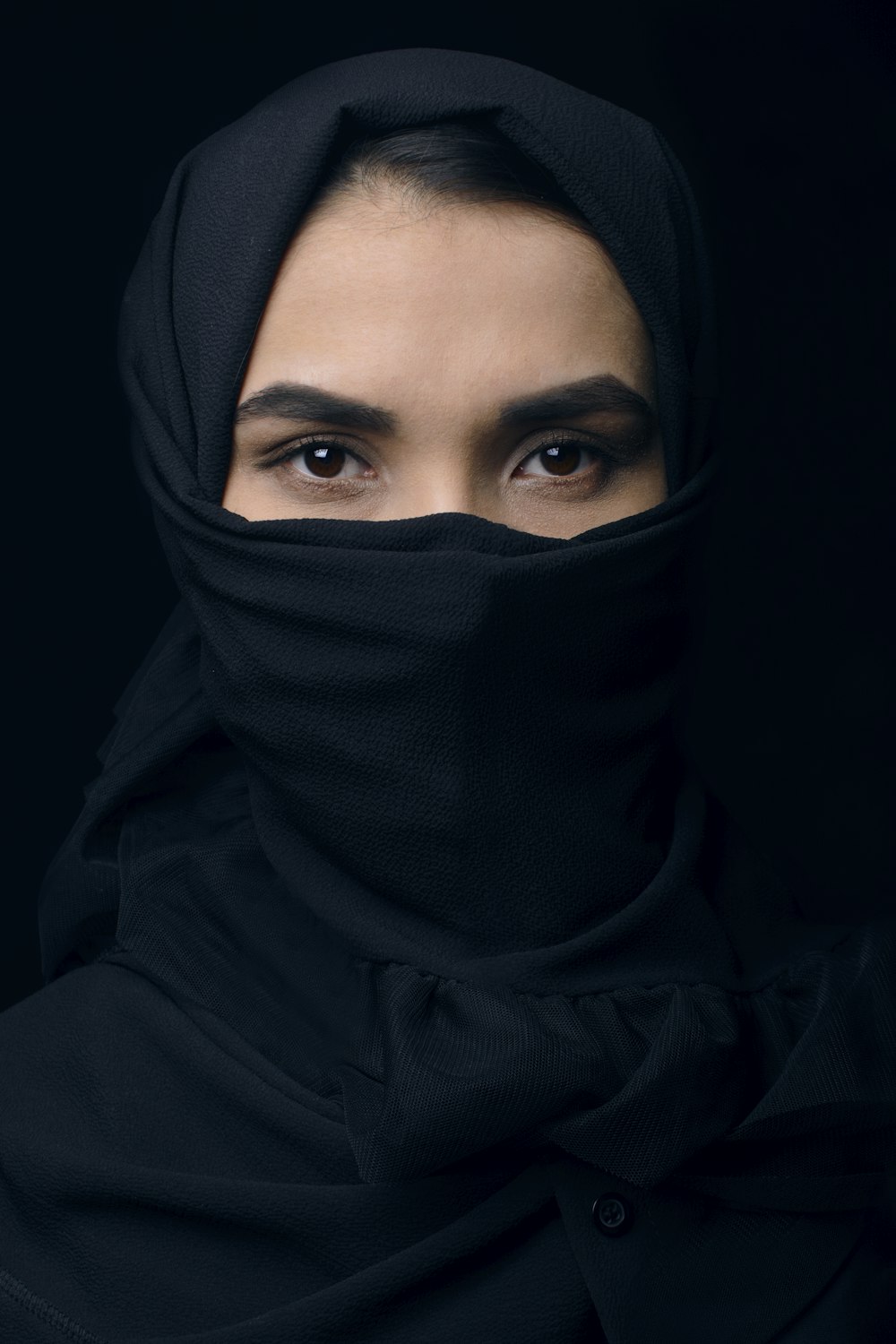 a woman wearing a black hijab