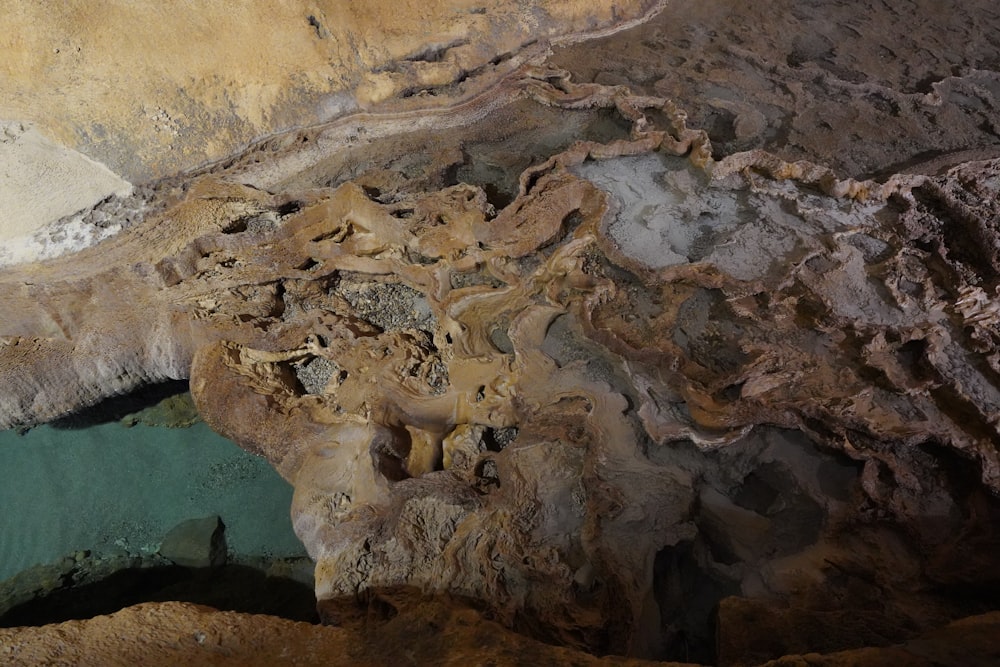 a cave filled with lots of rocks and water