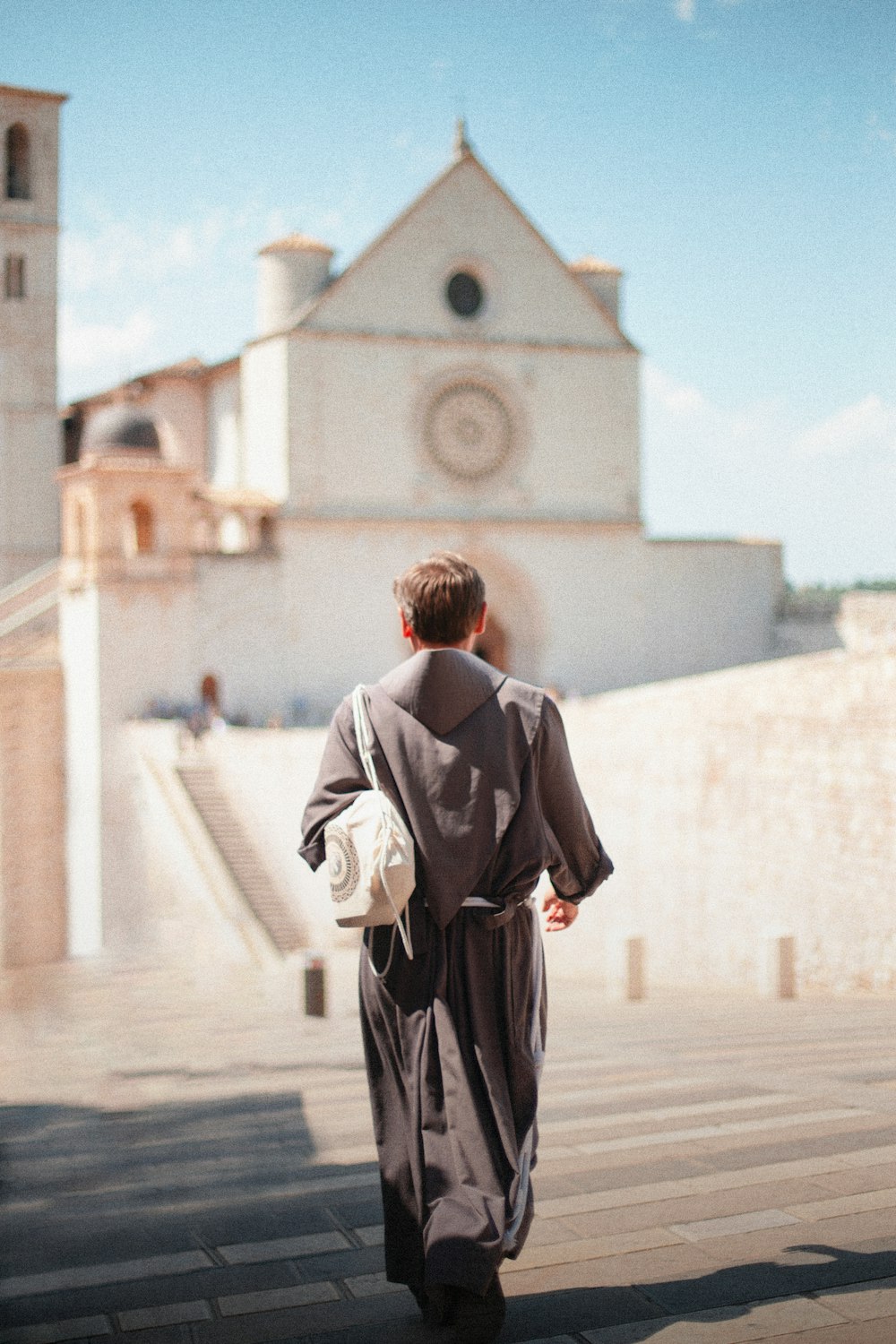 a person walking in front of a building