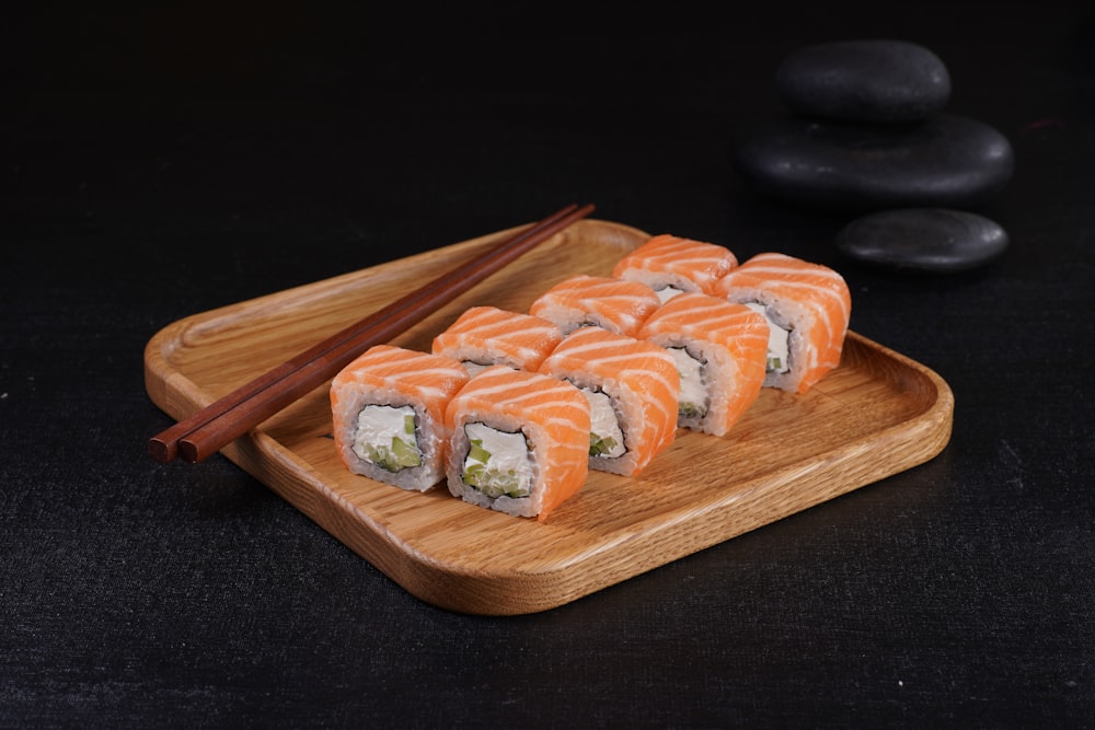 sushi on a wooden cutting board