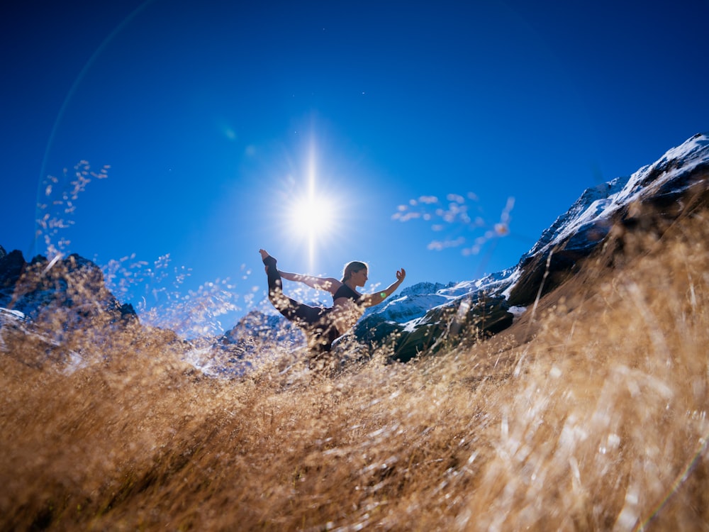 a person riding on top of a mountain