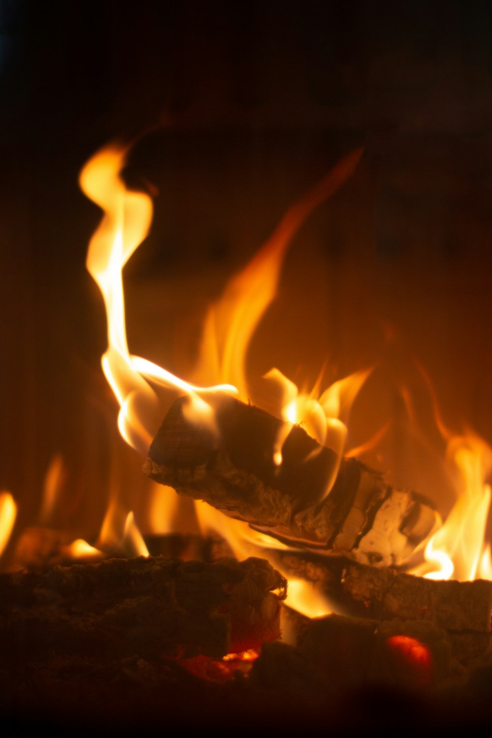 a close up of a fire burning in a fireplace