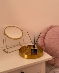 A modern bedroom dresser with drawer organizers and elegant trays holding jewelry and small items.