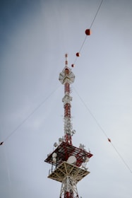 a tall tower with a lot of antennas on top of it