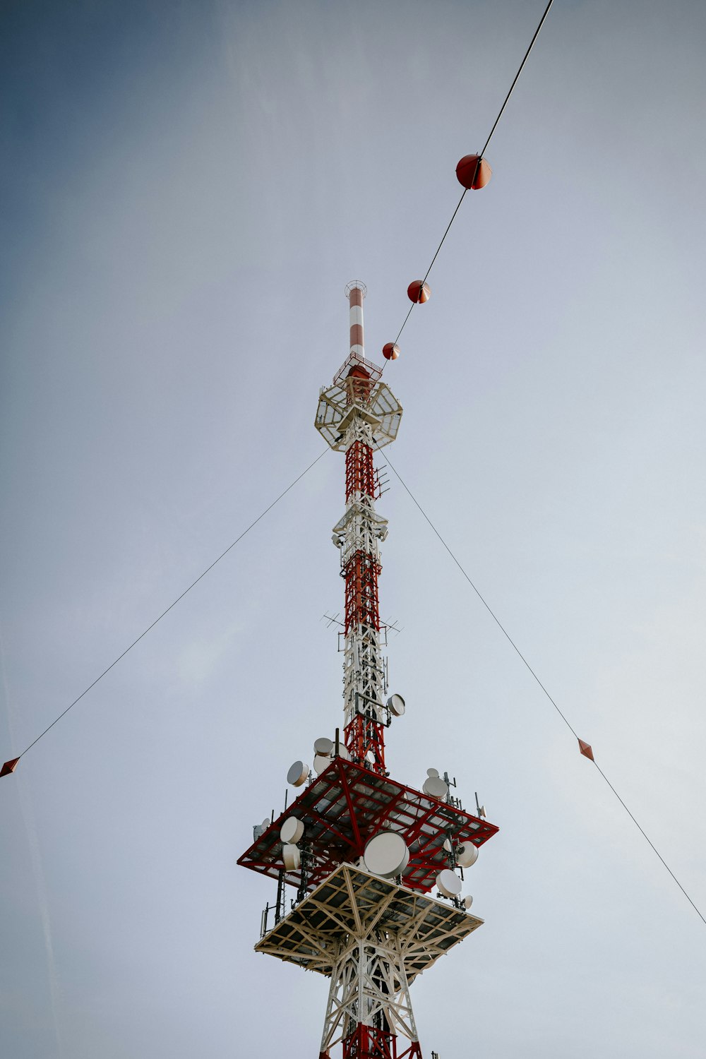 a tall tower with a lot of antennas on top of it