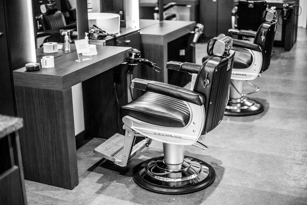 a black and white photo of a barber shop