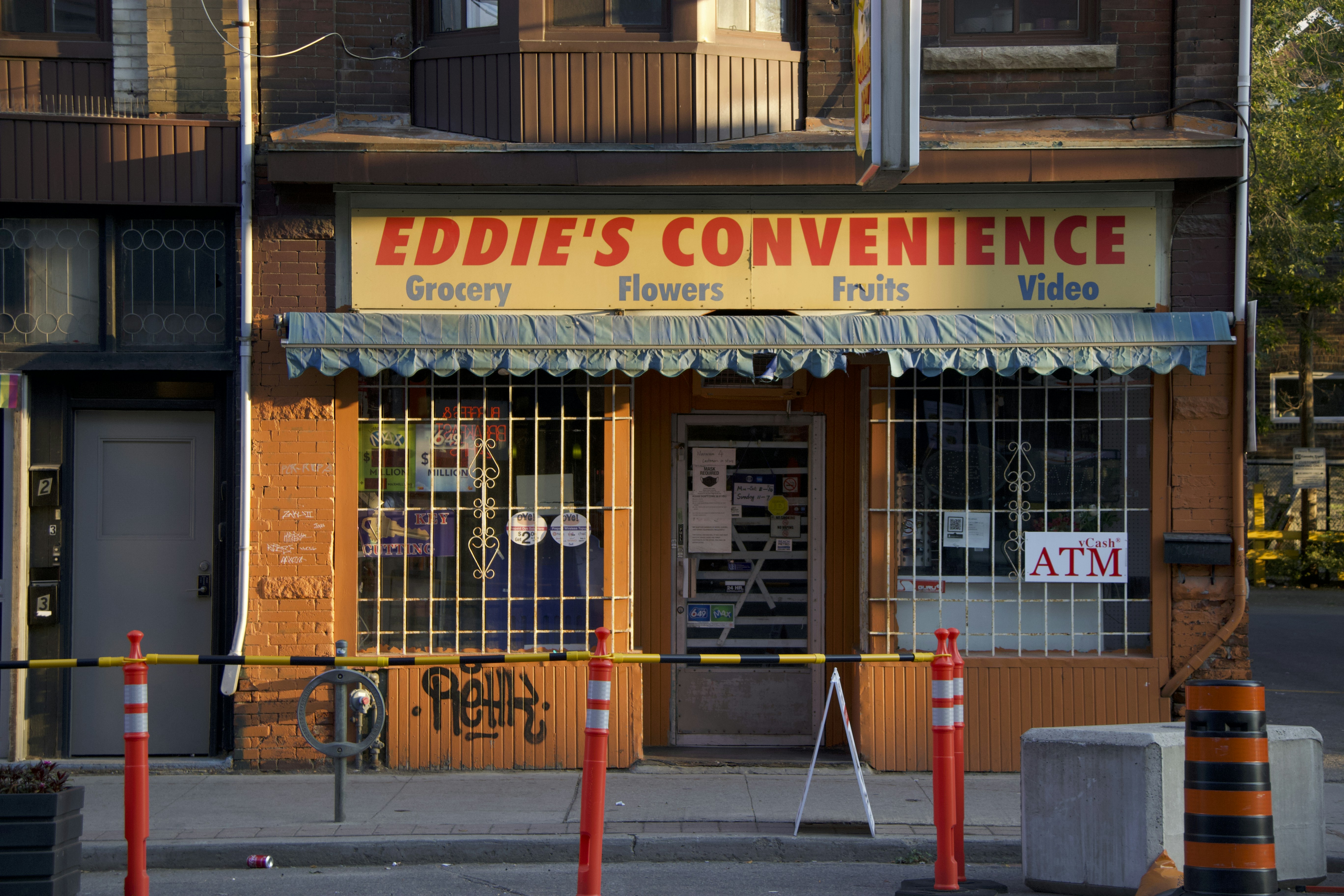 a store front with a fence around it
