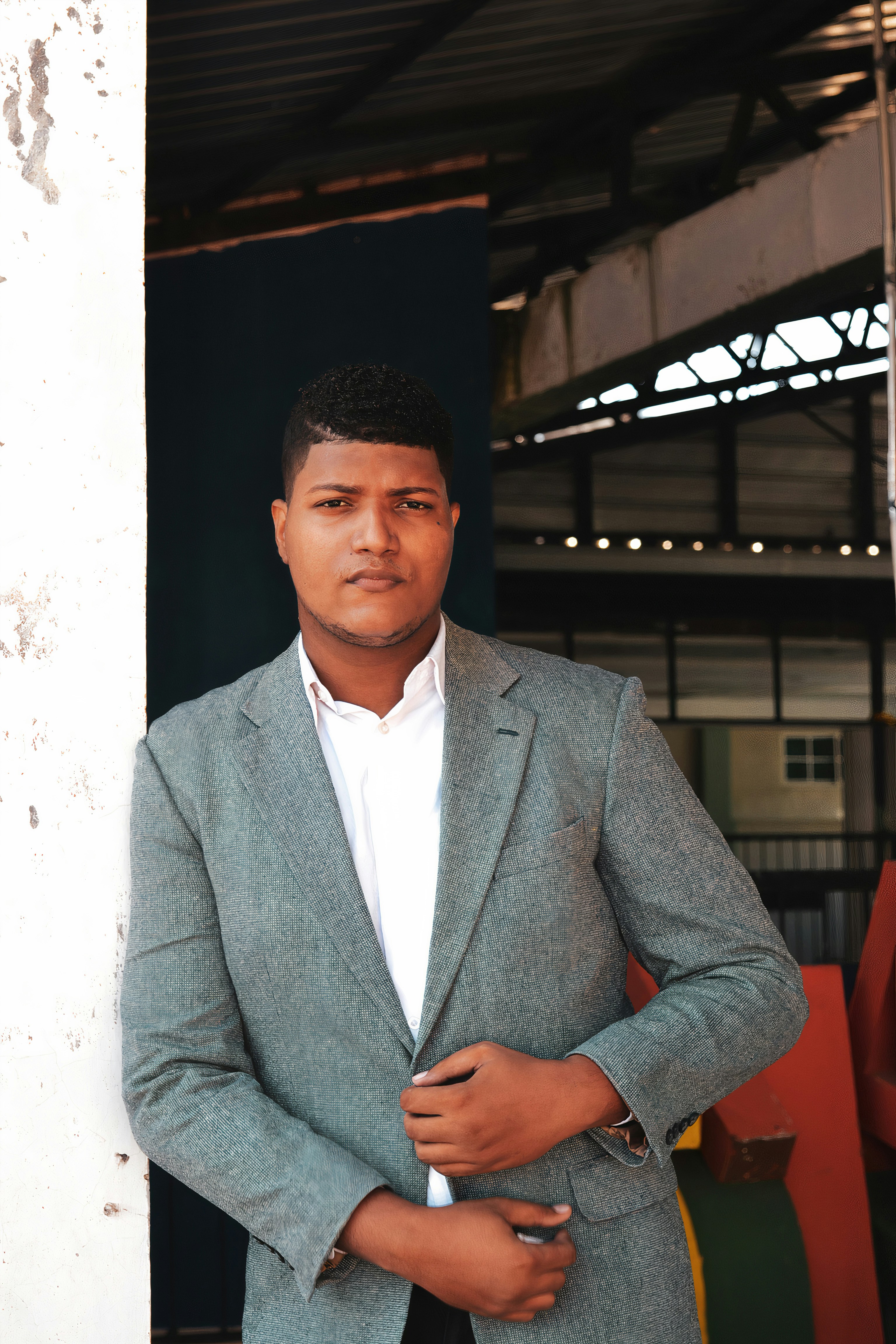 a man in a suit standing in a doorway