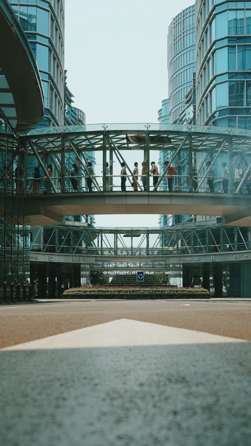 a group of people walking across a bridge