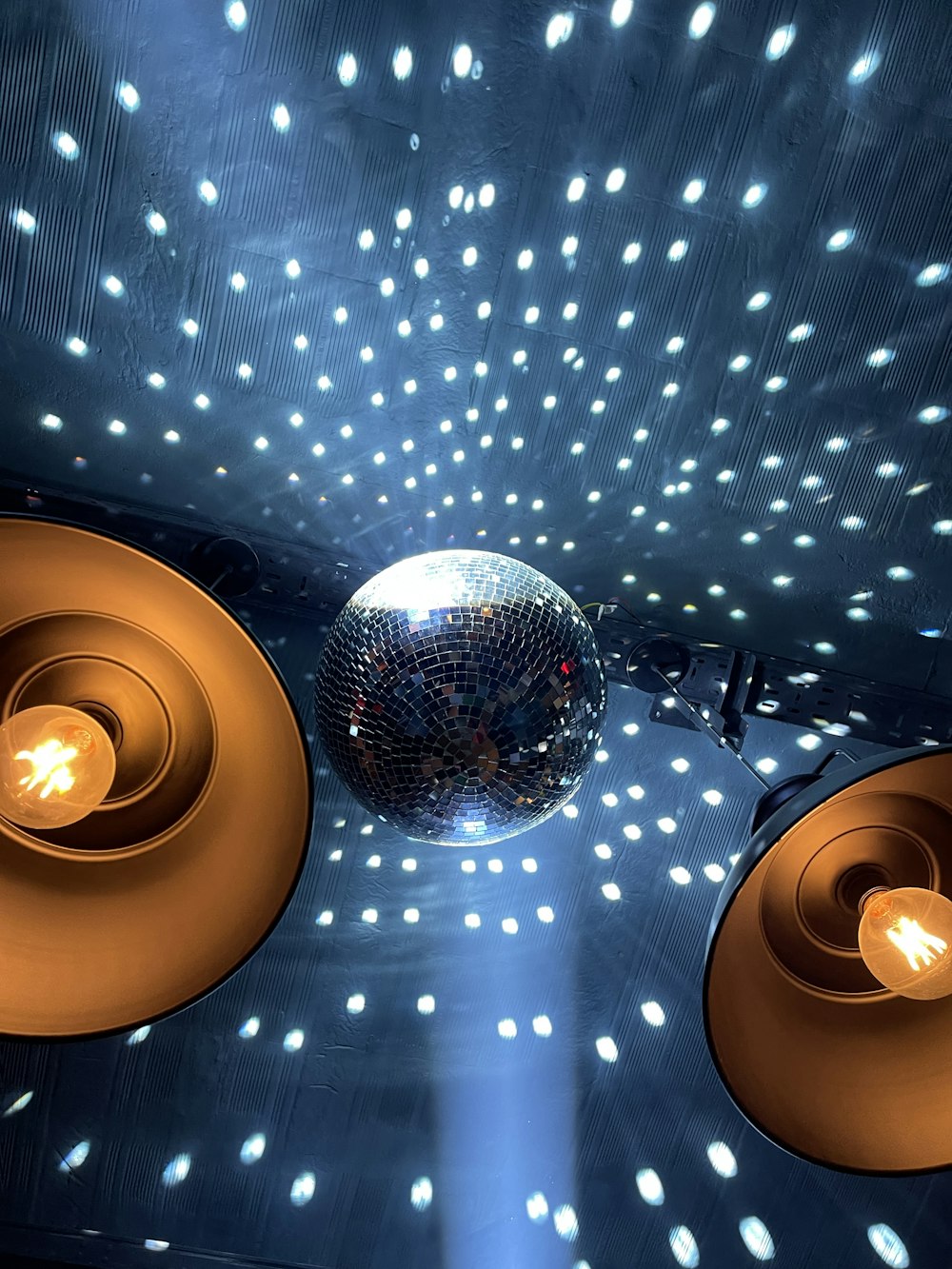 a disco ball hanging from the ceiling of a room