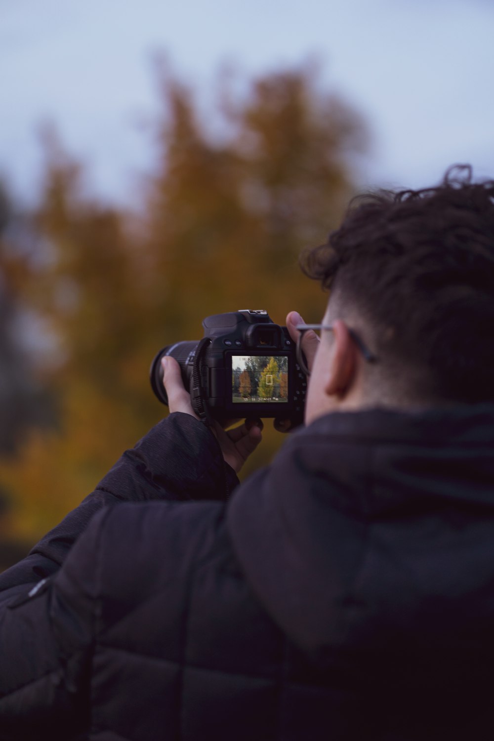 a man taking a picture with a camera