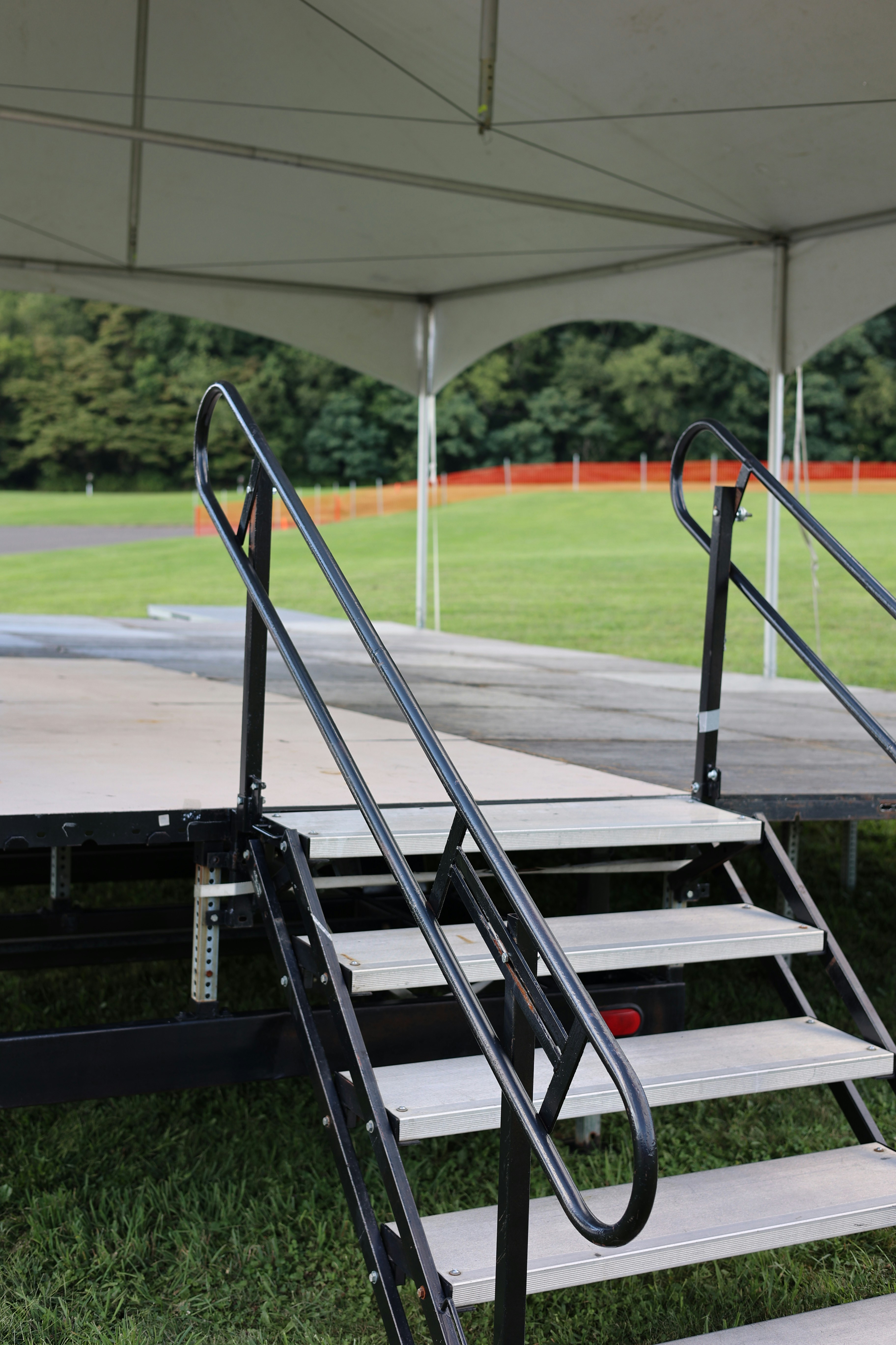 a set of stairs leading up to a baseball field