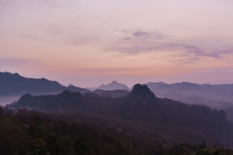 a view of a mountain range at sunset
