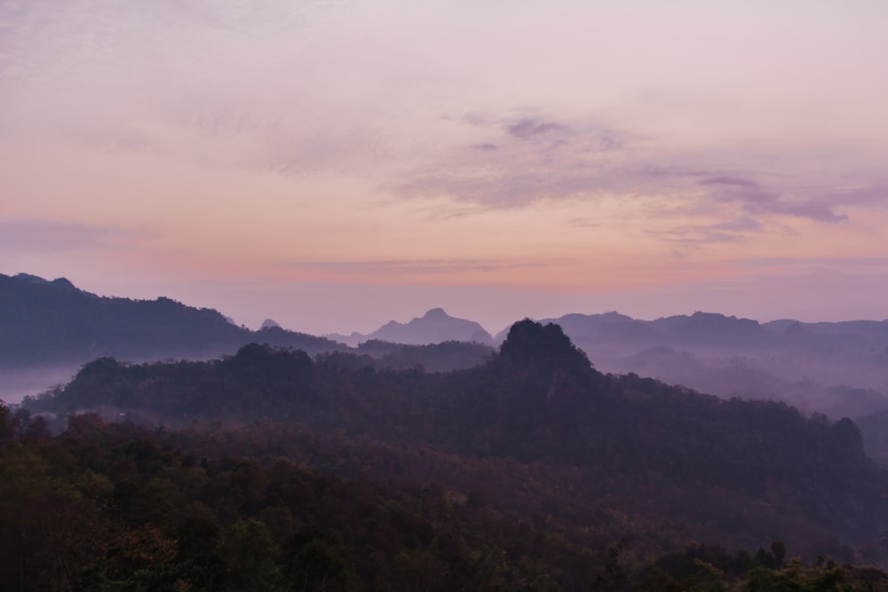 a view of a mountain range at sunset