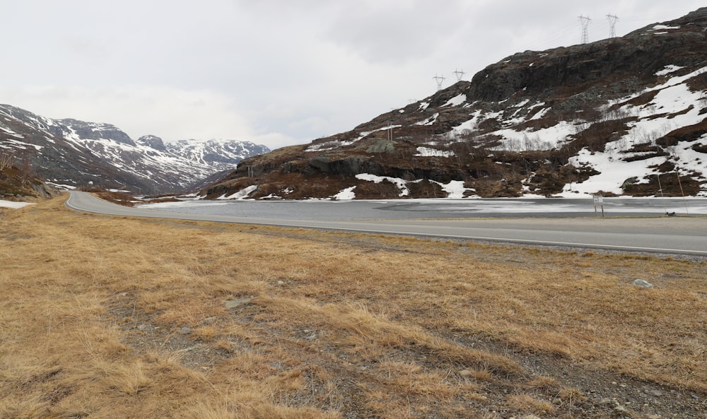 a road with a mountain in the background