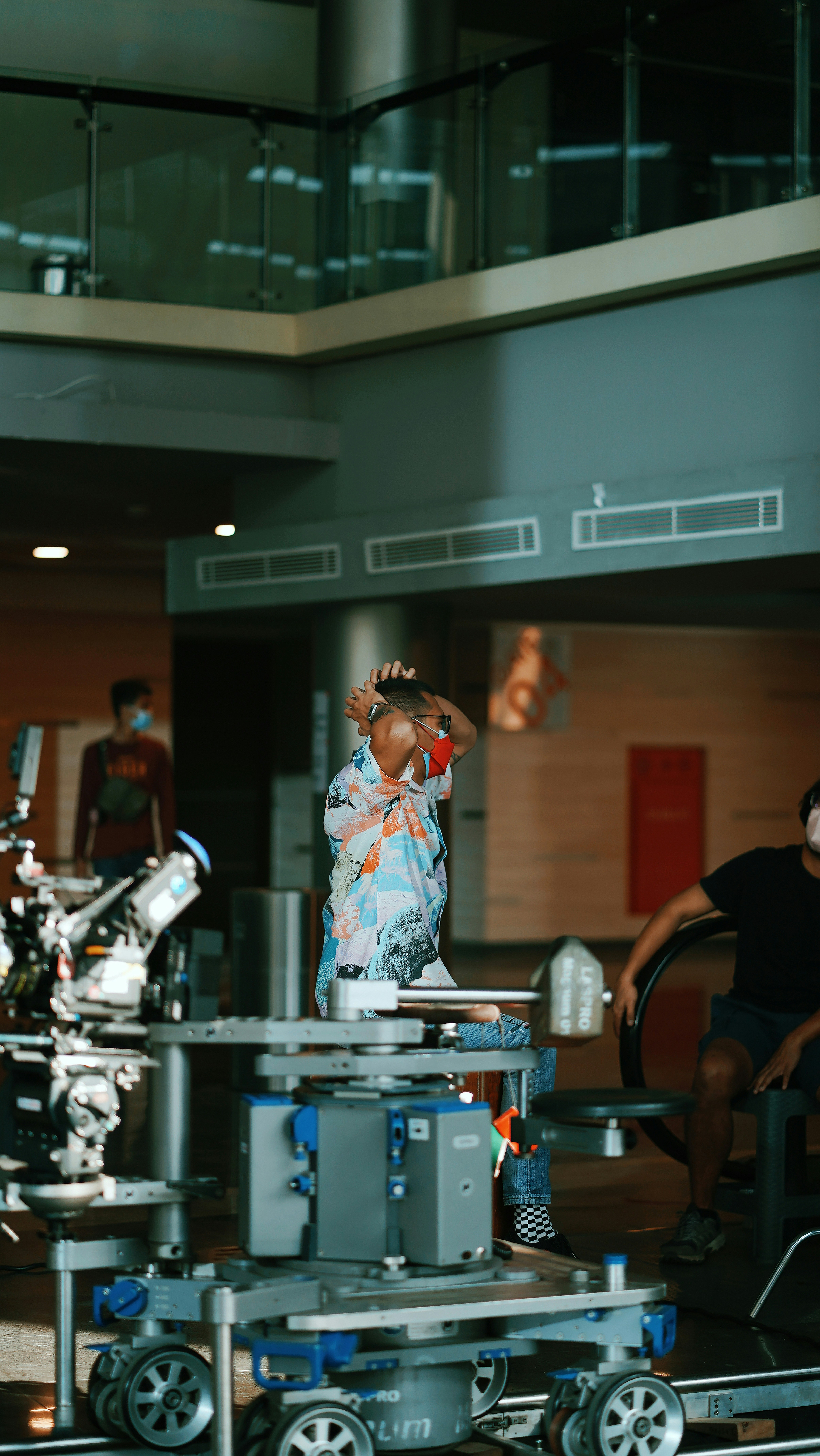 a woman standing in front of a machine in a building