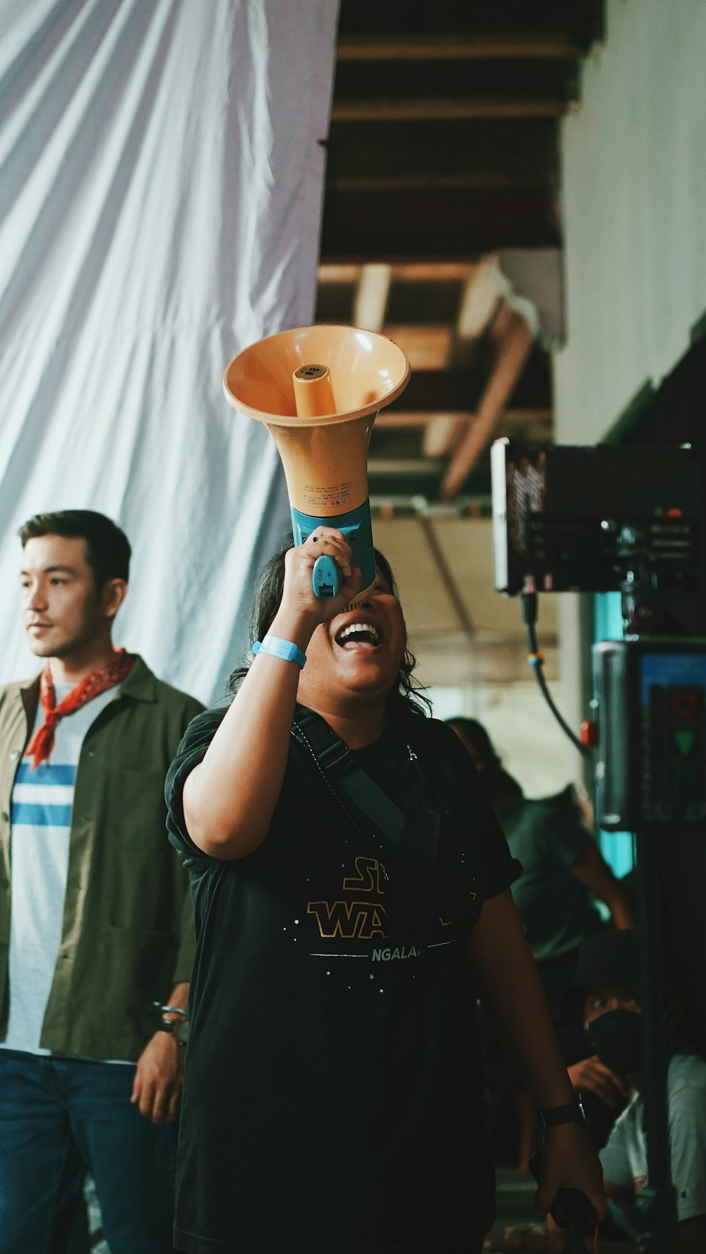 a woman is holding up a vase on her head