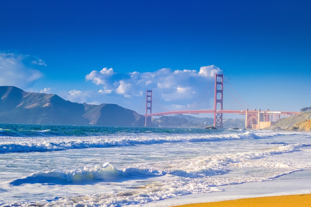 a view of the golden gate bridge from the beach