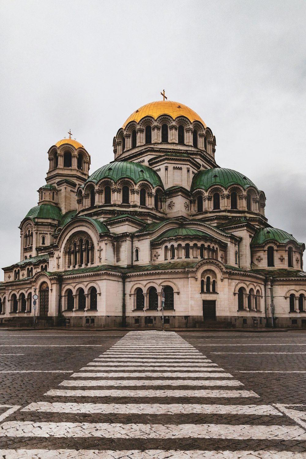 a large building with a yellow dome on top of it