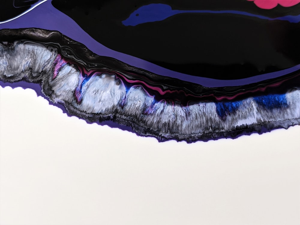 a close up of a black and purple object