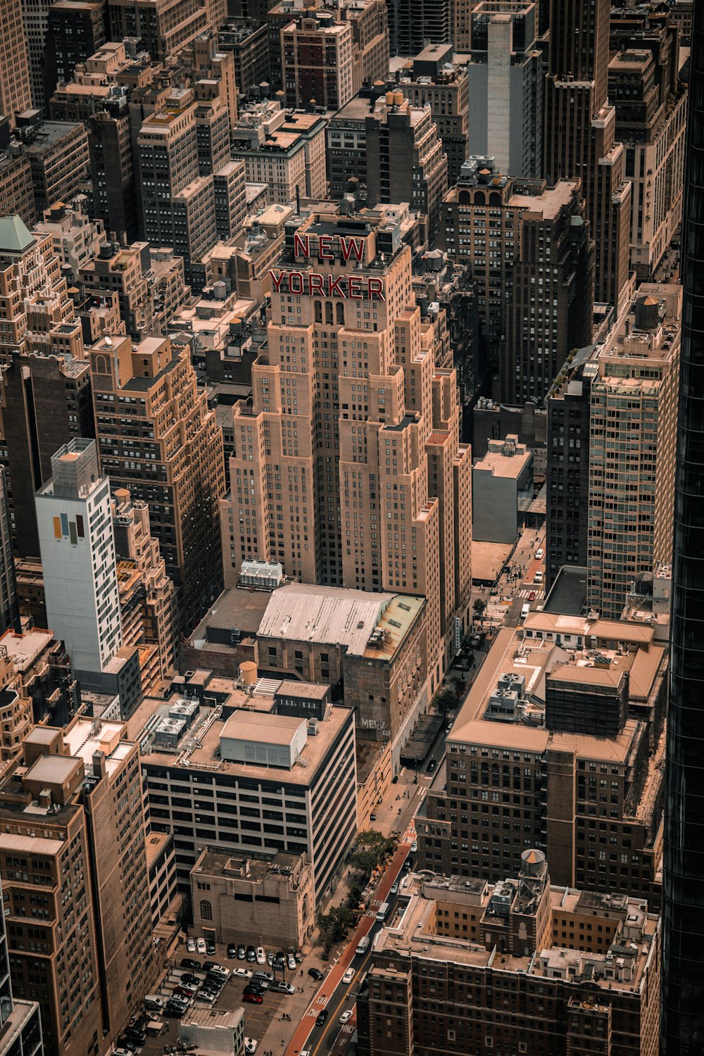 an aerial view of a city with tall buildings