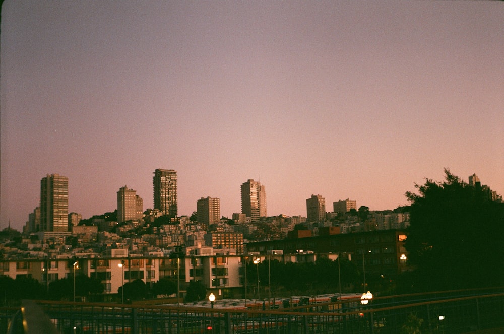 a view of a city skyline at dusk