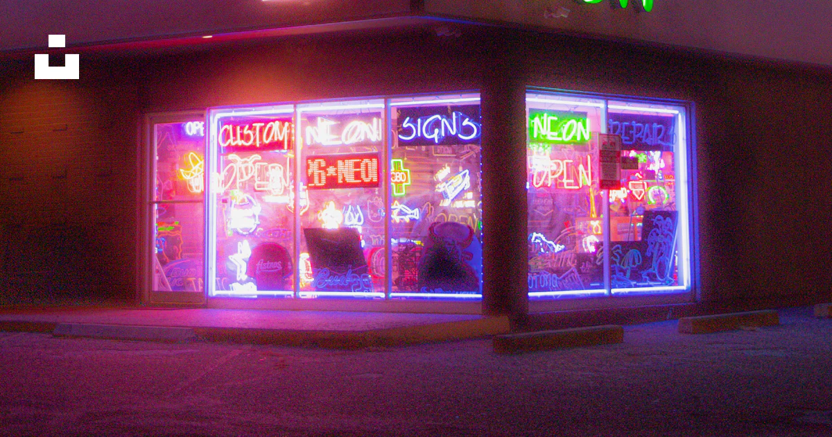 A neon lit neon store front at night photo – Free Neon Image on Unsplash