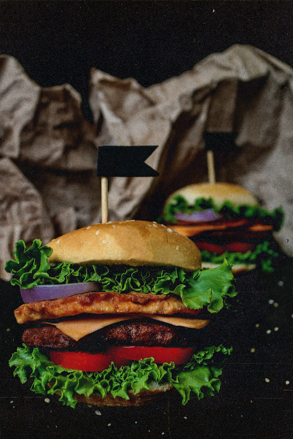 a couple of hamburgers sitting on top of a table