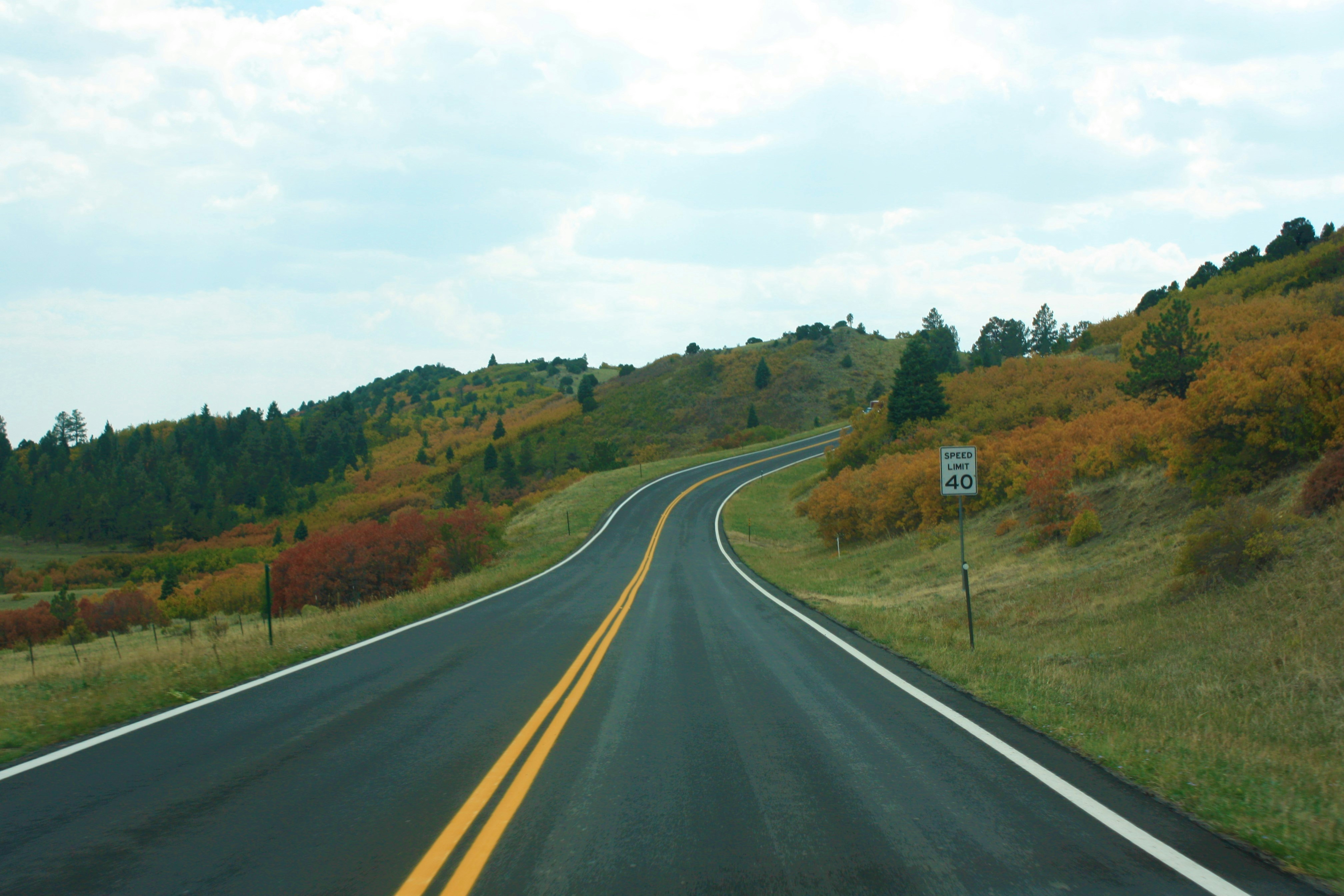 a road with a sign on the side of it