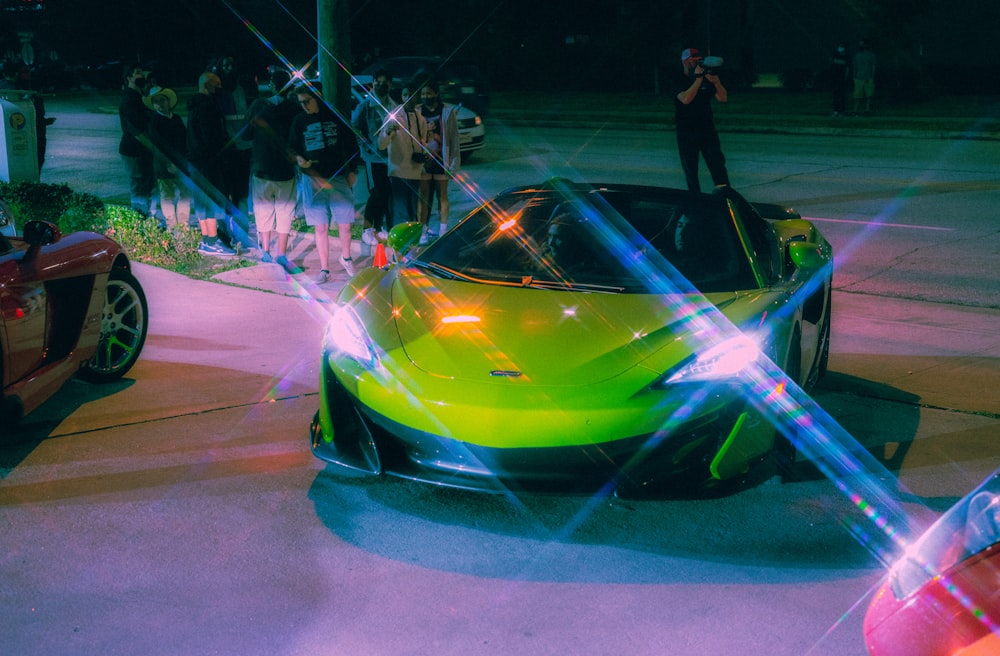 a neon green sports car parked on the side of the road