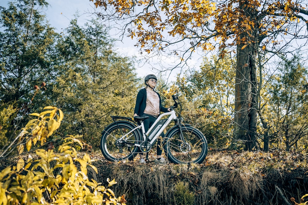 a person on a bike in the woods
