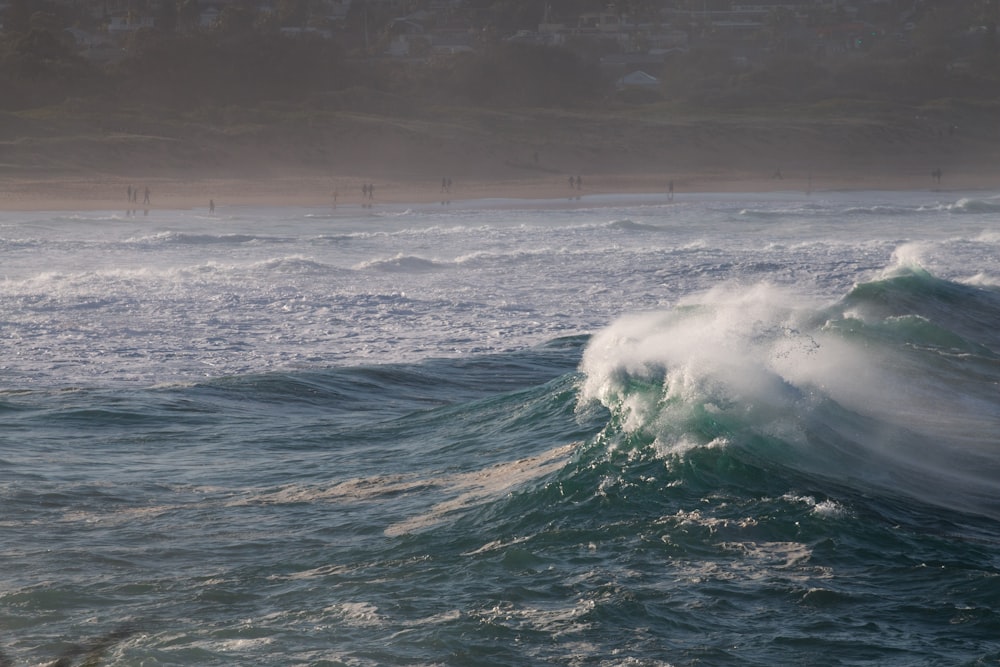 a person riding a surfboard on a wave in the ocean