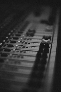 a black and white photo of a sound board