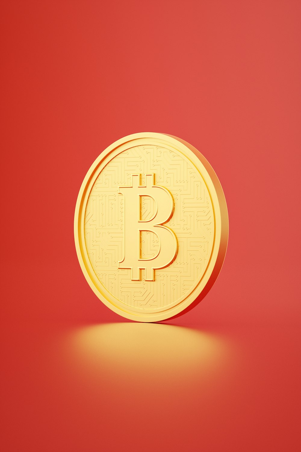 a gold bit coin on a red background