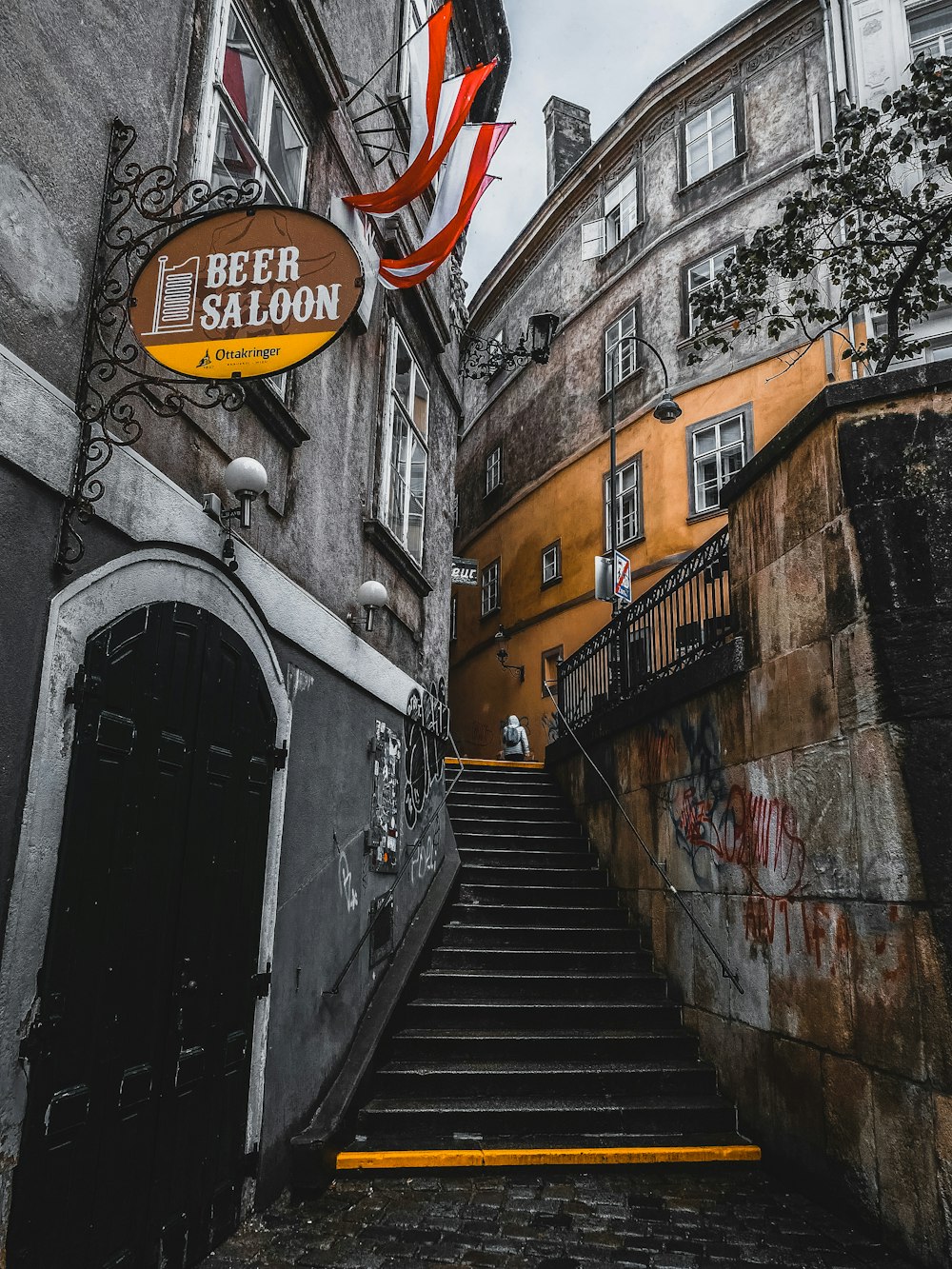a set of stairs leading up to a beer saloon