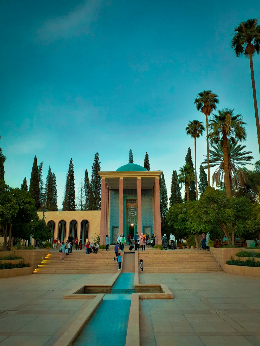 a large building with a fountain in front of it