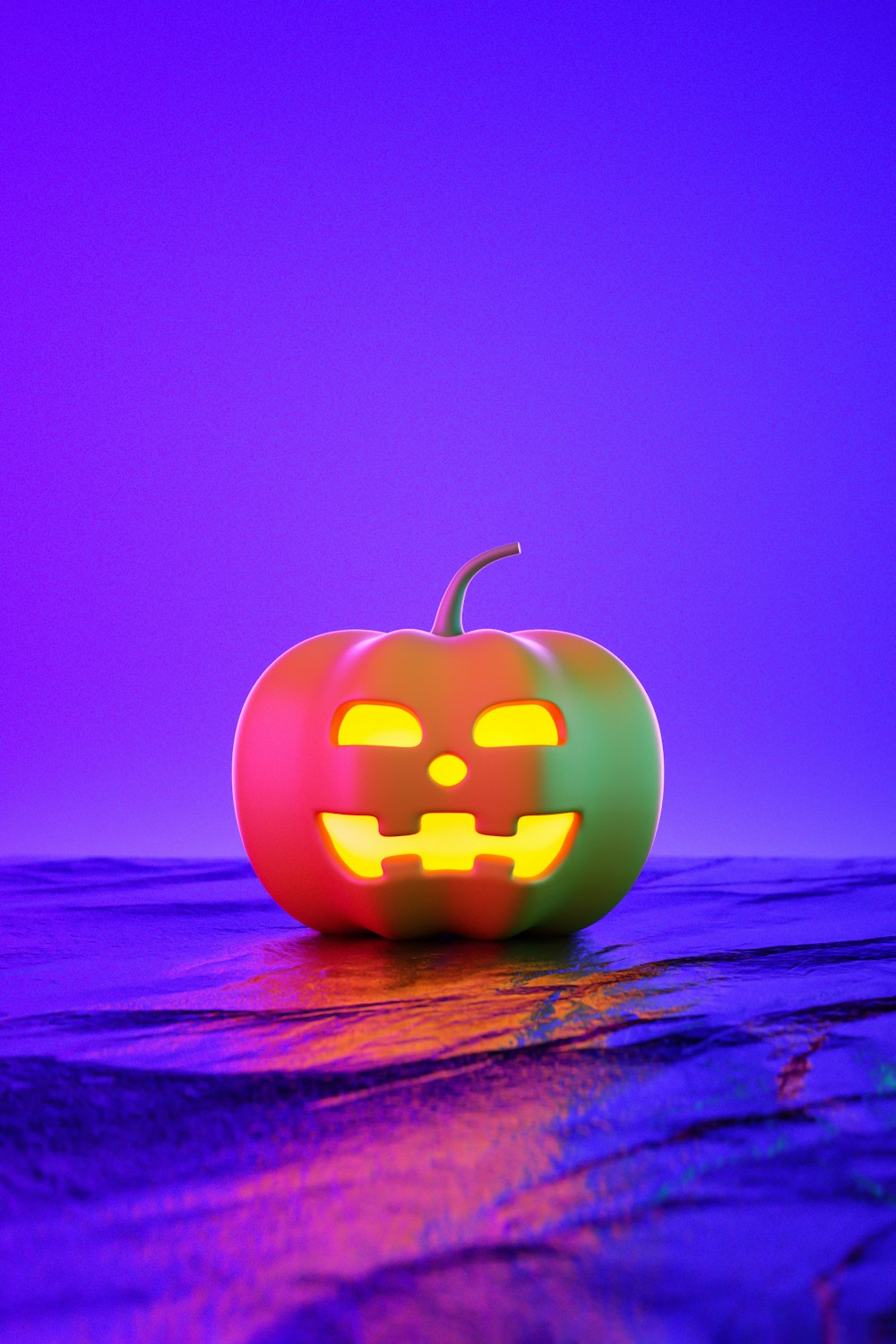 a halloween pumpkin with glowing eyes on a beach