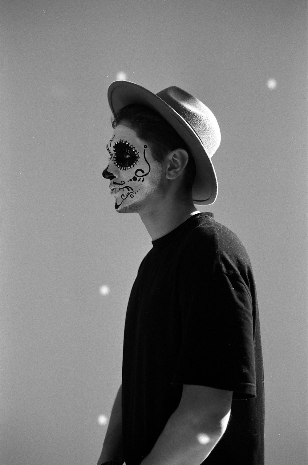 a man with a skeleton face paint on his face
